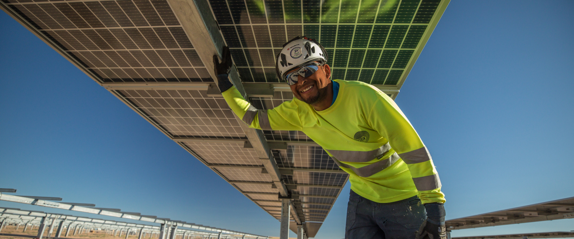 worker under solar panel