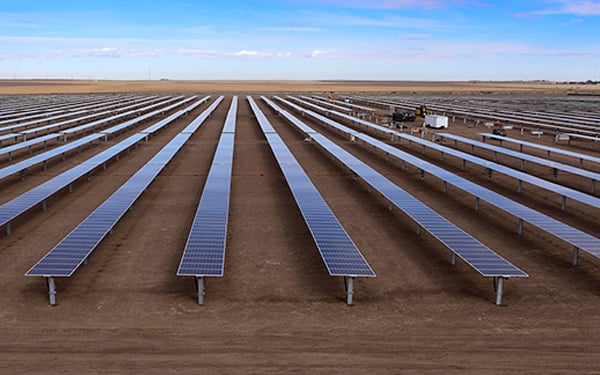 Rows of solar panels stretch across flat, open land at the Lightsource bp Johnson Corner solar project in Kansas, part of their US Projects portfolio.