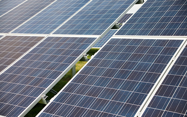 Close-up of solar panels installed on a solar farm, generating renewable energy from sunlight.