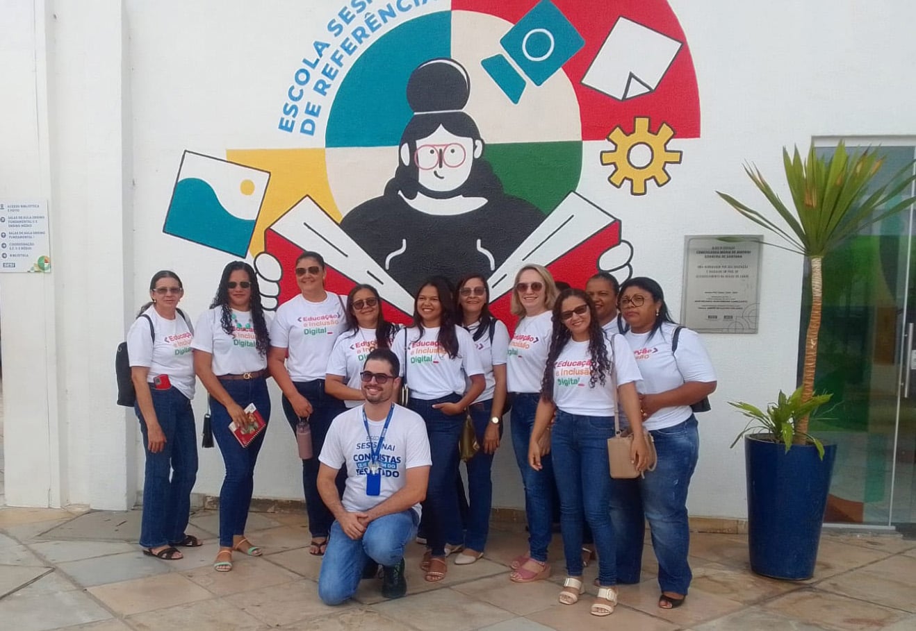 School teachers outside Brazil school supported by Lightsource bp