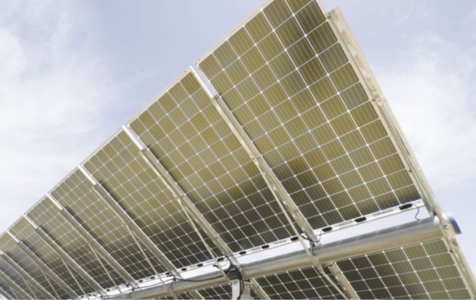 Close-up of solar panels tilted towards the sky