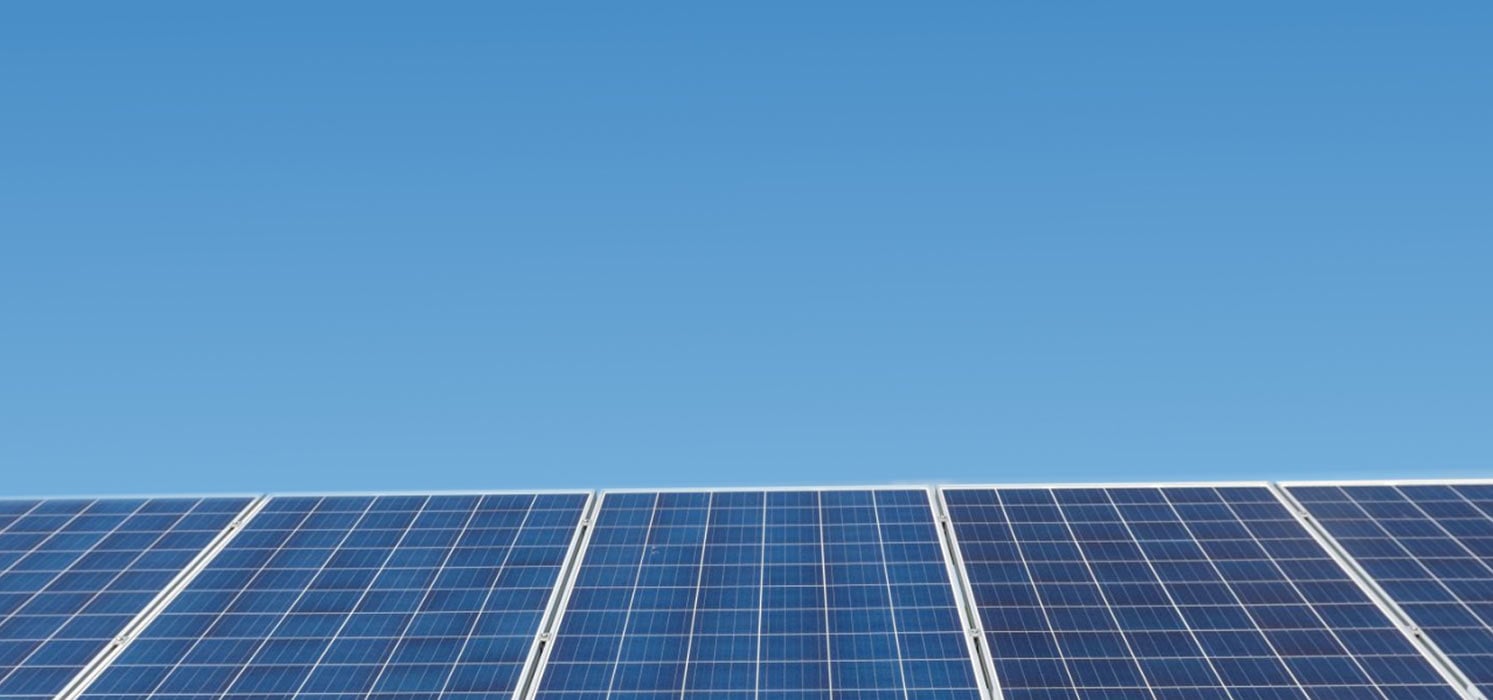 Solar panels against a clear blue sky