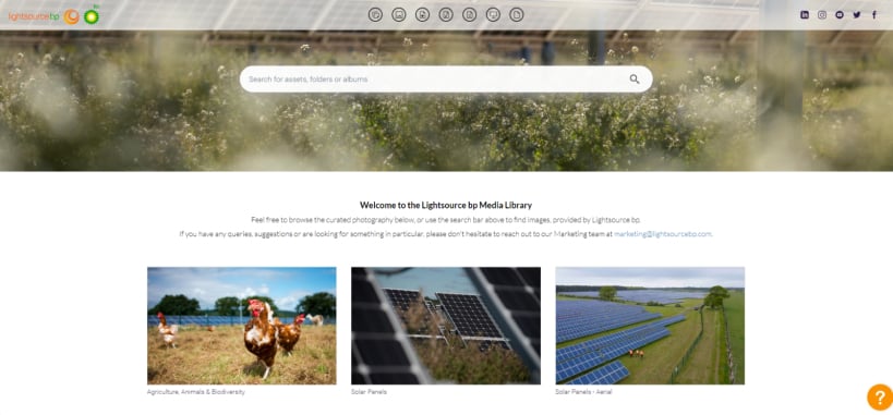 Screenshot of the Lightsource bp Media Library homepage, featuring a search bar, a welcome message, and a selection of preview images related to renewable energy and sustainability.