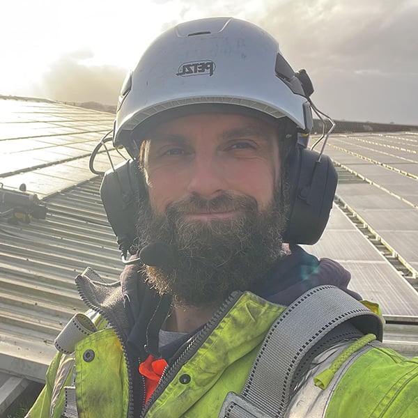 Jack Ayres in full PPE on a solar farm