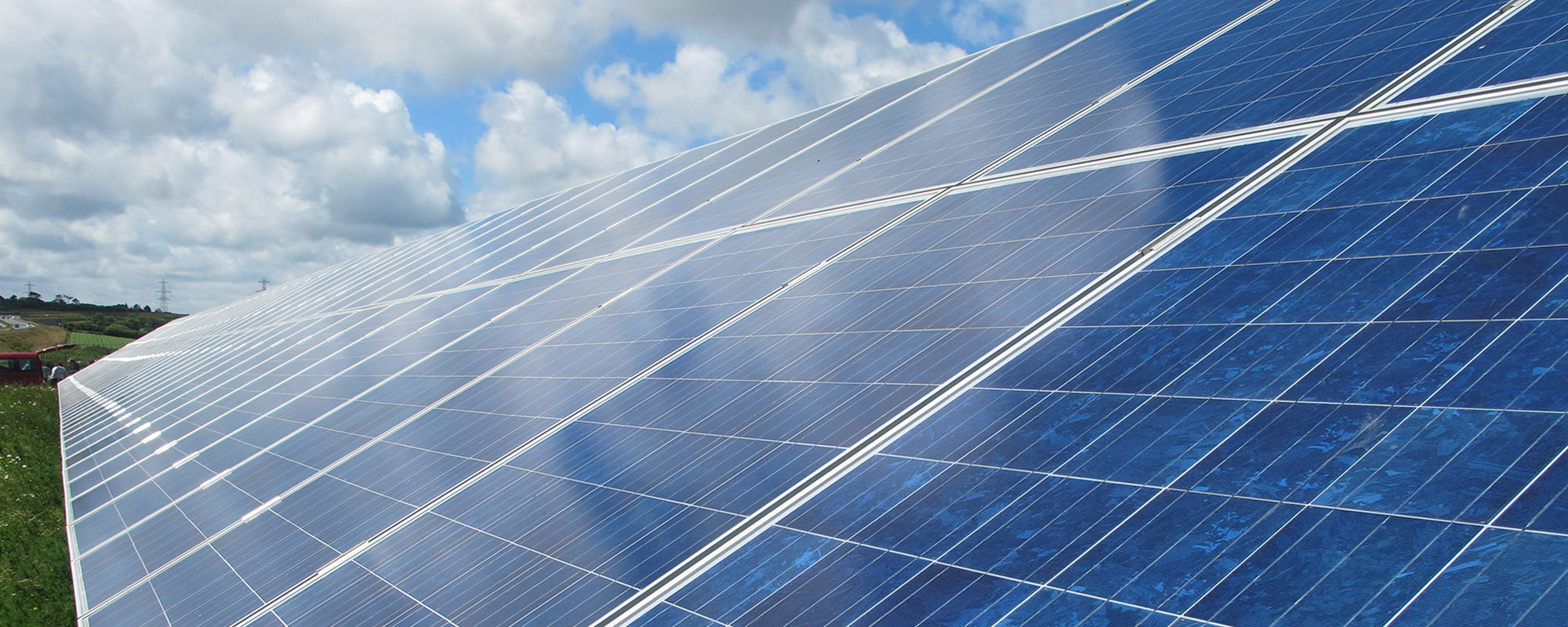 Close-up of solar panels installed on a solar farm, generating renewable energy from sunlight.