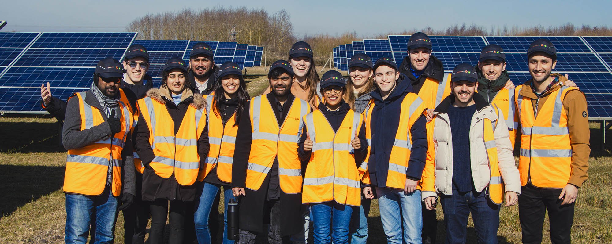 Group photo on a solar farm, ESCP students in full PPE