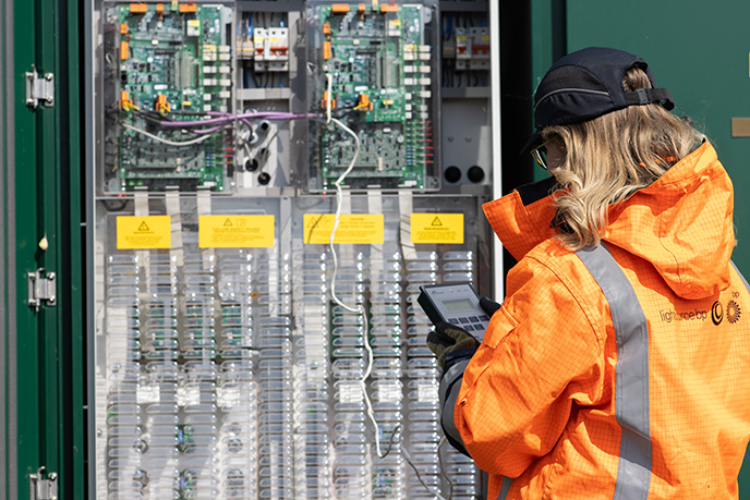 Engineer inspecting battery system